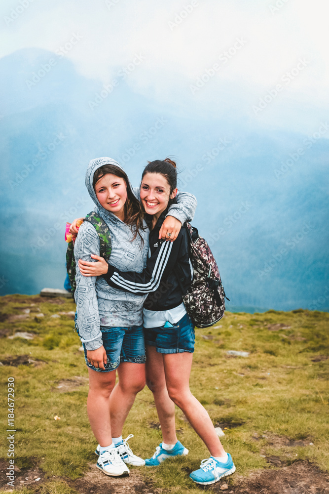 Girls posing against the background of the mountains