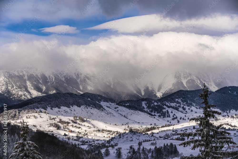 Beautiful winter landscape with Carpati Piatra Craiului mountains in Romania Beautiful winter landscape with Carpati Piatra Craiului mountains in Romania