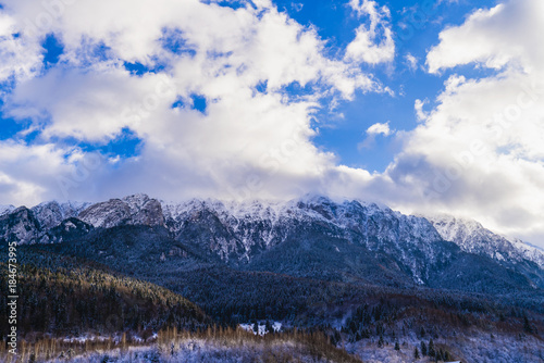 Beautiful winter landscape with Carpati Piatra Craiului mountains in Romania