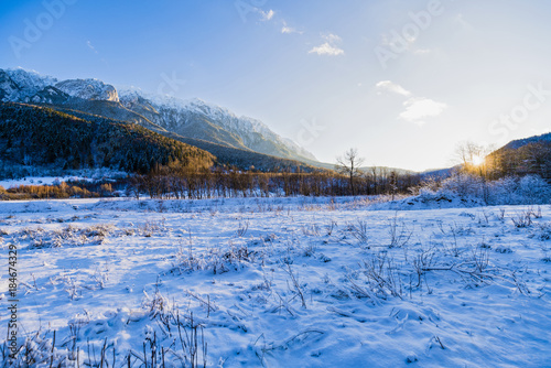 Beautiful winter landscape with Carpati Piatra Craiului mountains in Romania