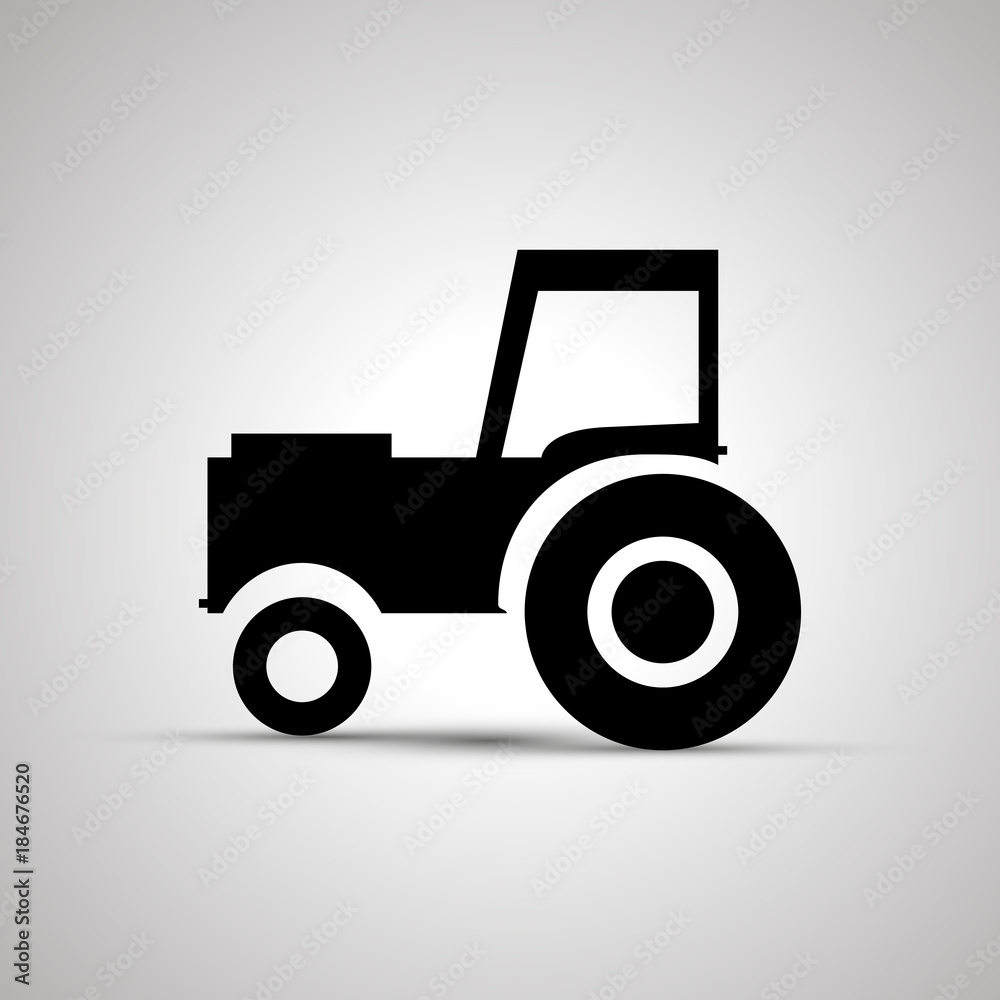 Tractor silhouette, side view simple black icon Tractor silhouette, side view simple black icon