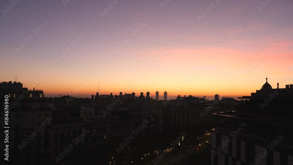 Sunset over rooftops Barcelona, shot from balcony on Passeig de Gracia. Sunset over rooftops Barcelona, shot from balcony on Passeig de Gracia.
