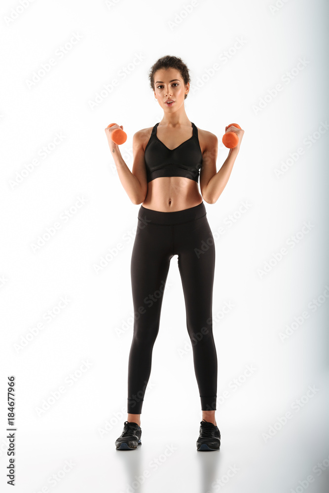 Full length image of Pretty fitness woman doing exercise Full length image of Pretty fitness woman doing exercise