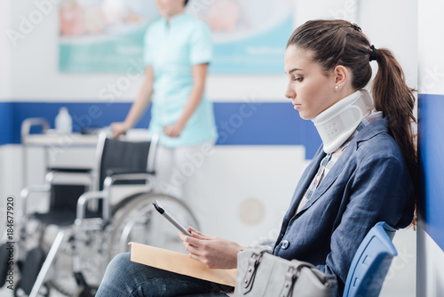 Young patient in the waiting room at the hospital photo