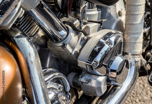 Chromed motorcycle parts on a sunny day