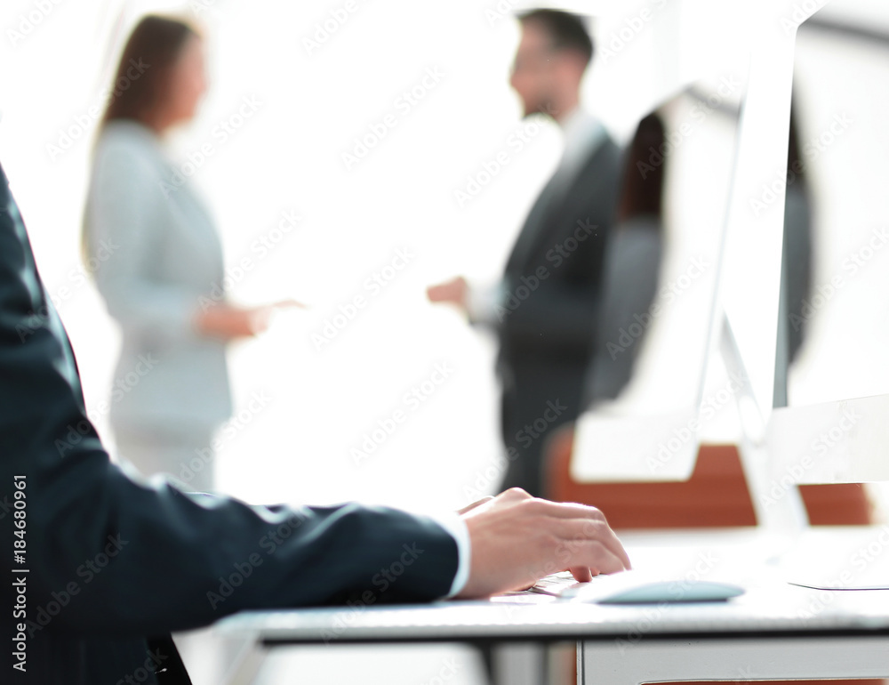 employee is typing on the computer keyboard. employee is typing on the computer keyboard.