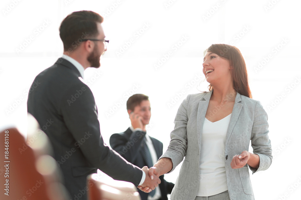 handshake between colleagues in the workplace handshake between colleagues in the workplace