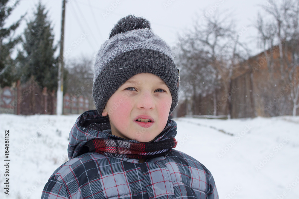 boy in winter hat with pompom boy in winter hat with pompom