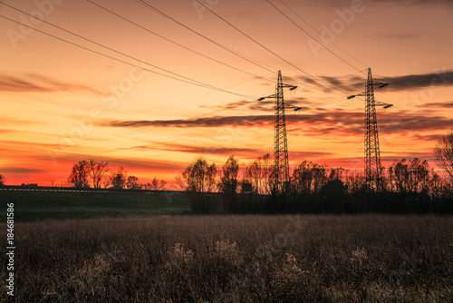 High Voltage Pylons Electricity Distribution at Sunset