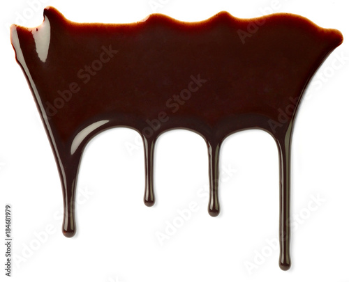 close up of a chocolate syrup on white background