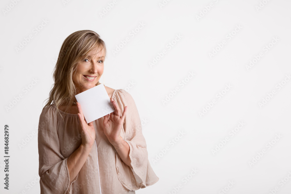 Woman showing holding blank card, note, message Woman showing holding blank card, note, message