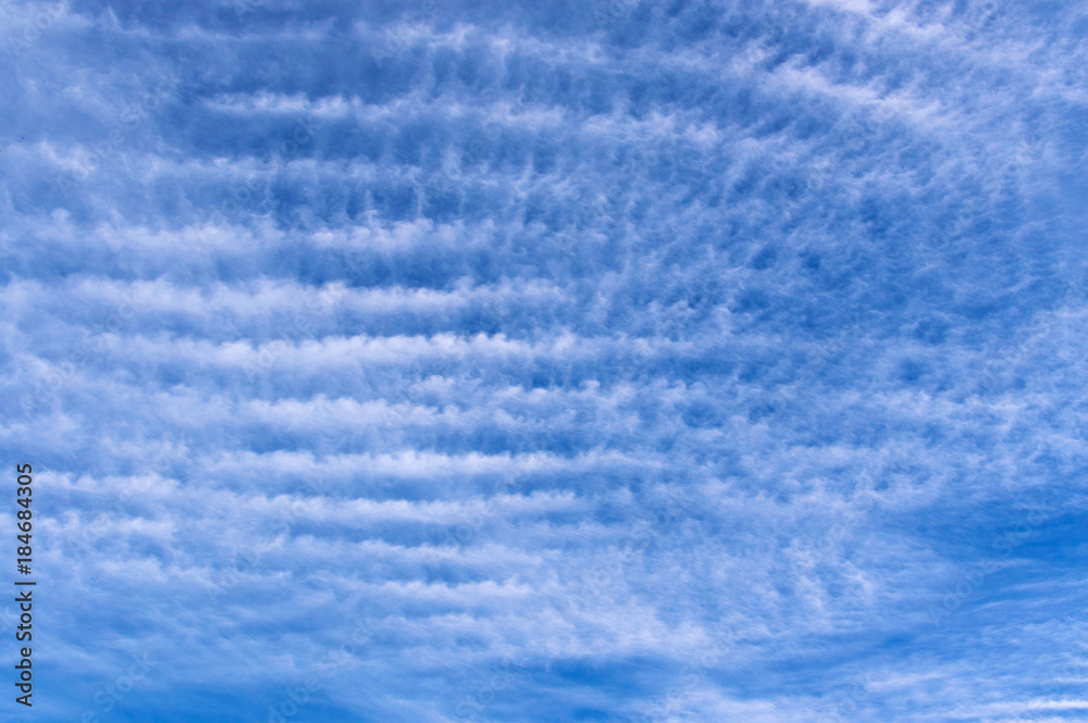 Beautiful skyscape with fluffy wave clouds