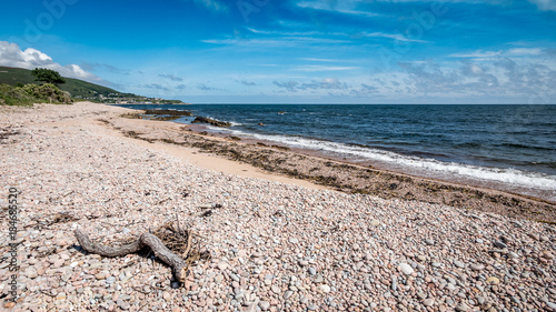 North Sea coastline, Sutherland, Scotland. A summer view of the pebble beach near the Highland town of Helmsdale in the north east of Scotland.