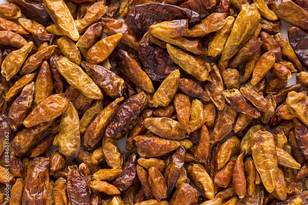 texture of a dried hot chili pepper on the white background texture of a dried hot chili pepper on the white background