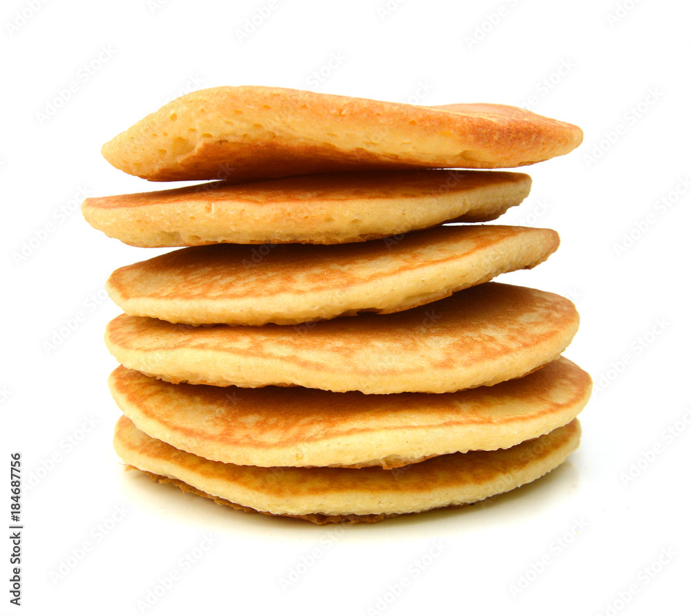 A stack of plain pancakes on a white background. A stack of plain pancakes on a white background.