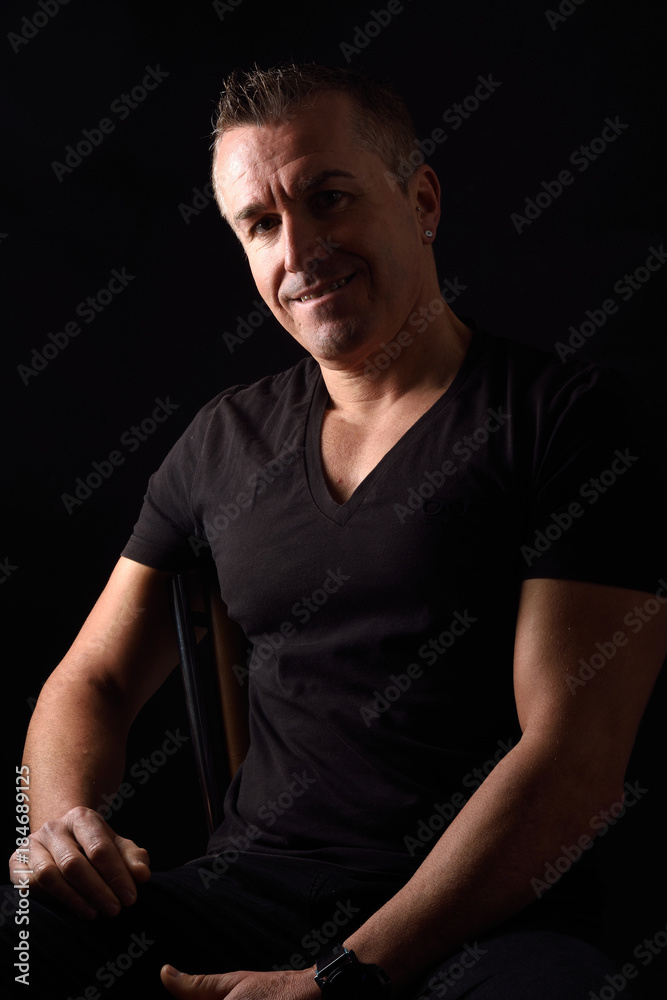 portrait of a man on black background