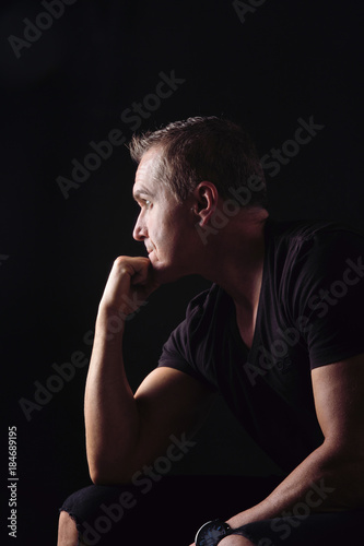 portrait of a man on black background