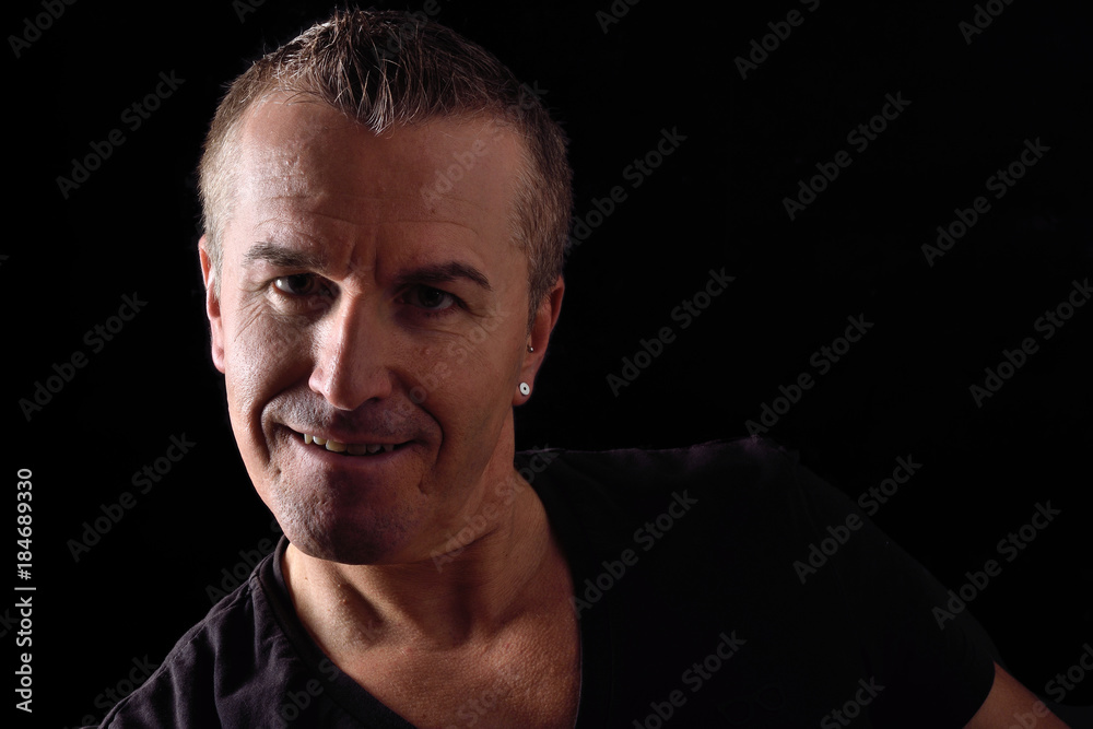 portrait of a man on black background portrait of a man on black background