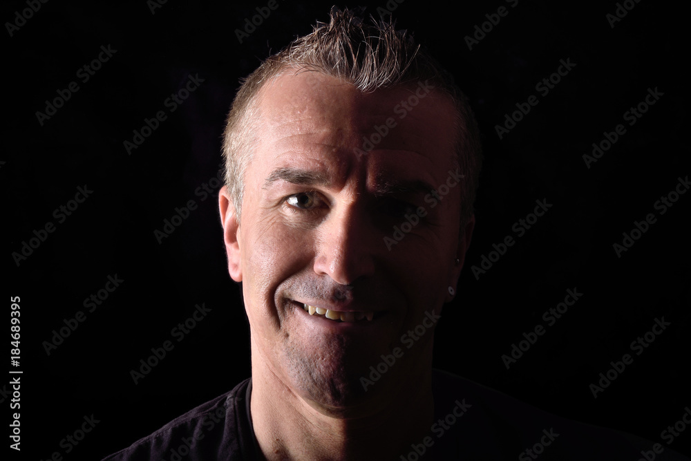 portrait of a man on black background portrait of a man on black background