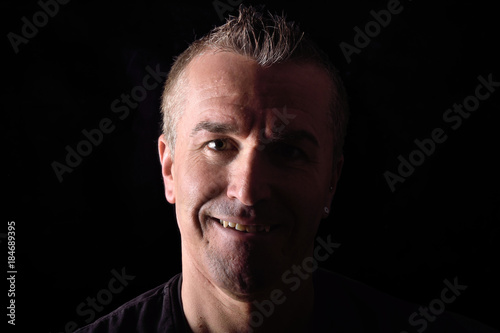 portrait of a man on black background