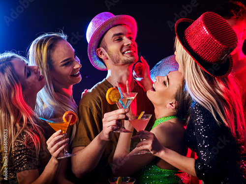 Dance party with group people dancing. How to be an alpha male at a club. Women and confident casual smiling man have fun in night club. Seduce boozy woman cuddles up guy .