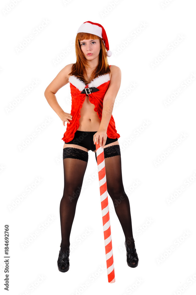 Attractive young woman in Santa costume with stick. Isolated on white Attractive young woman in Santa costume with stick. Isolated on white