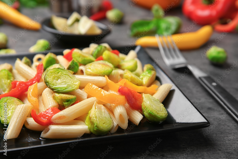 Plate of pasta with Brussels sprouts on table Plate of pasta with Brussels sprouts on table