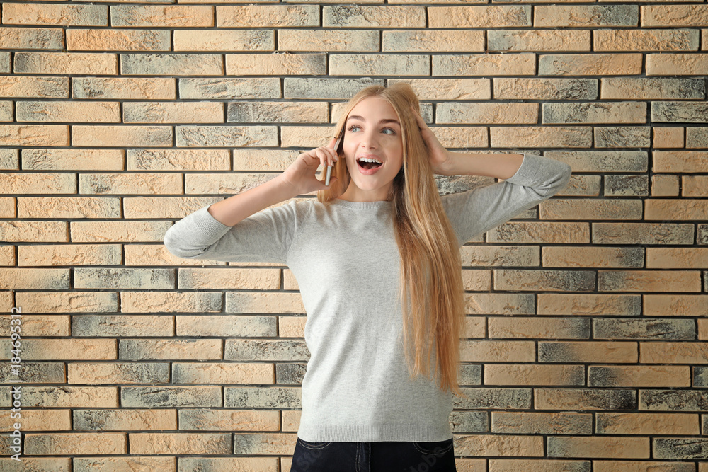 Emotional businesswoman with mobile phone on white background Emotional businesswoman with mobile phone on white background