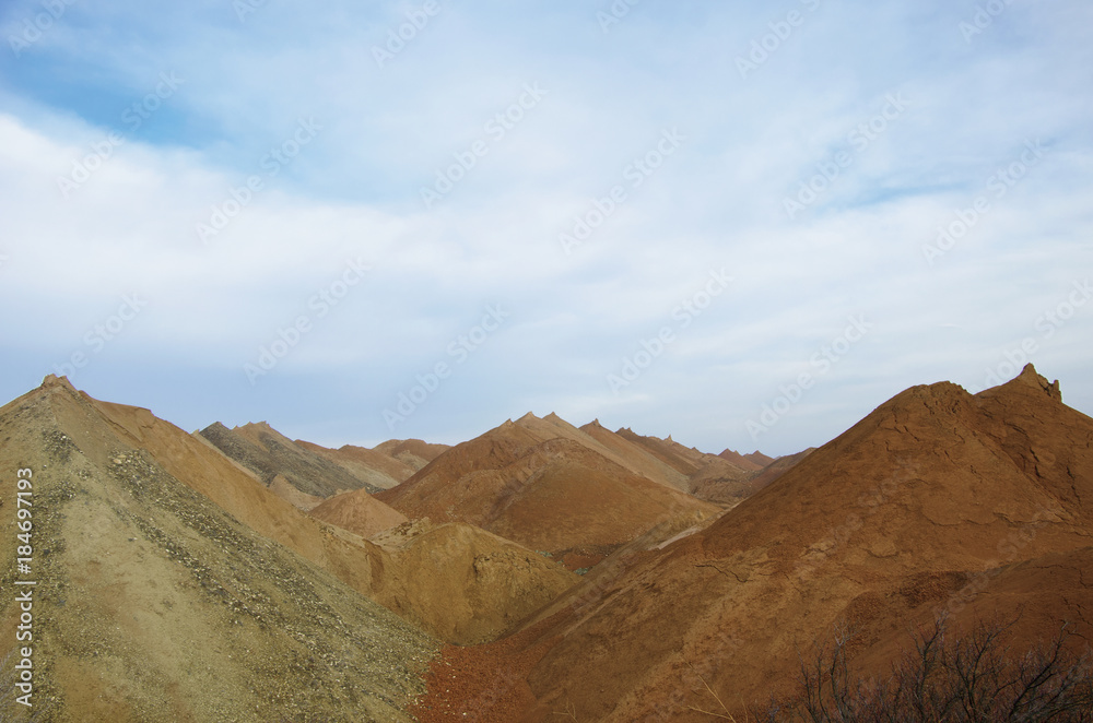 multicolored hills of the quarry for the extraction of manganese ore