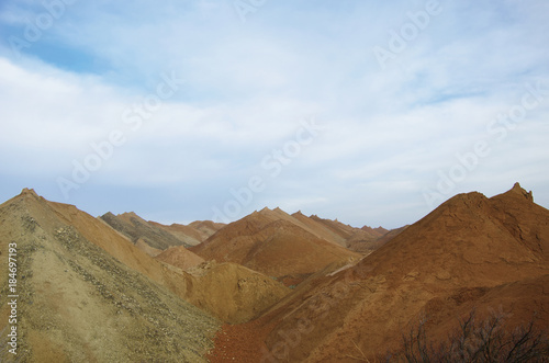 multicolored hills of the quarry for the extraction of manganese ore