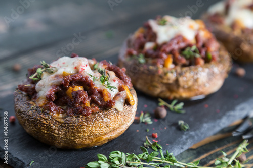 Vászonkép Stuffed mushrooms with beef cheese and spices