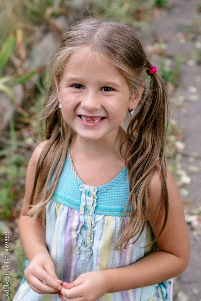 Beautiful summer portrait of a cute little girl. Beautiful summer portrait of a cute little girl.