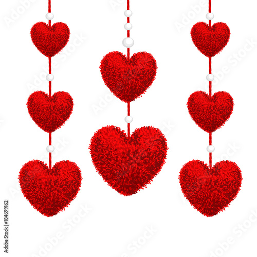 Decortive elements with pom-poms in the shape of a heart