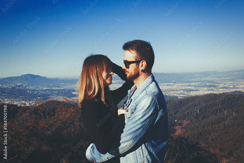 couple hugging in the mountains
