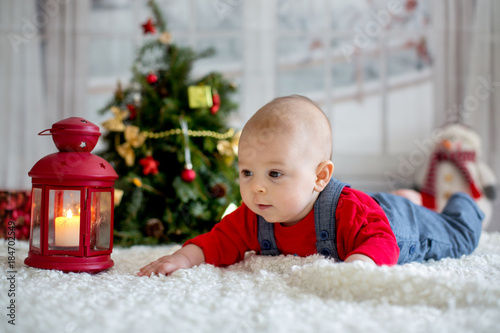 Portrait of newborn baby in Santa clothes and christmas hat
