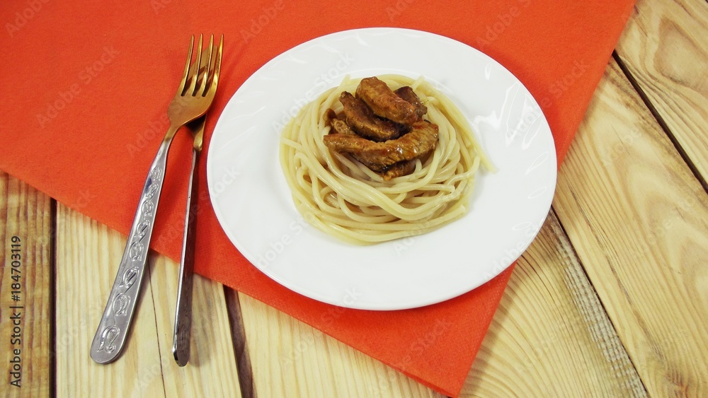 Delicious spaghetti with meat on a white plate. Delicious spaghetti with meat on a white plate.