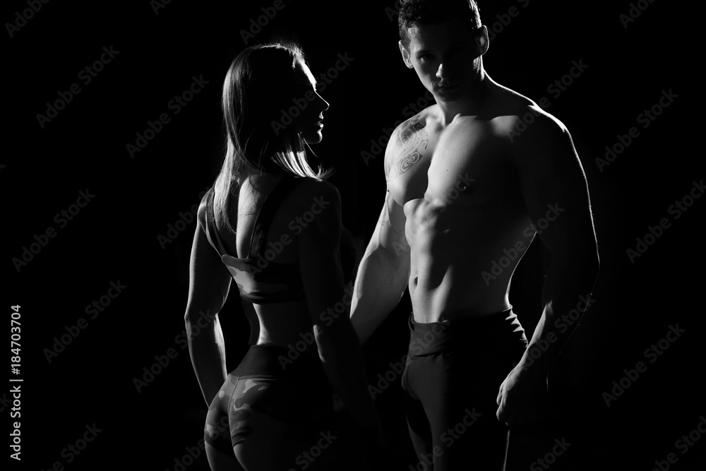 Sports man and woman. Silhouettes on a black background.