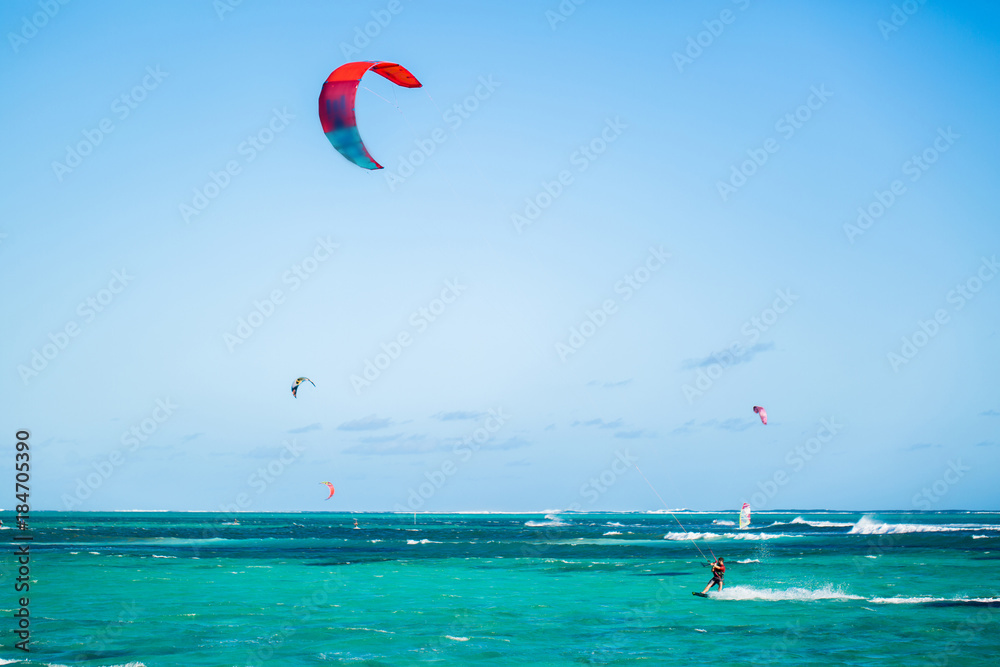 Kitesurfers on the Le Morne beach in Mauritius Kitesurfers on the Le Morne beach in Mauritius