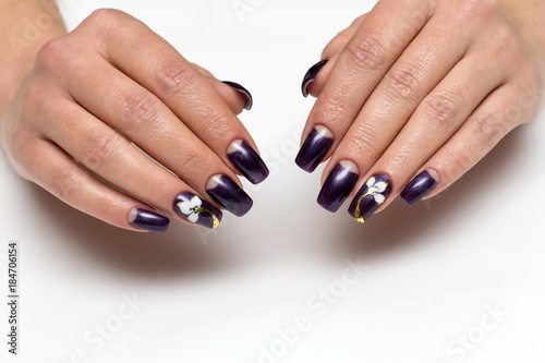 Purple moon manicure with flowers on long square nails on a white background  
