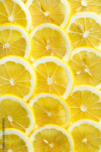 A slices of fresh yellow lemon texture background pattern