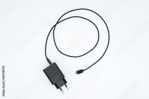 Top view of black phone AC charger and USB cable