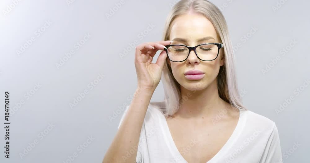 Beautiful blonde woman student take off glasses Beautiful blonde woman student take off glasses