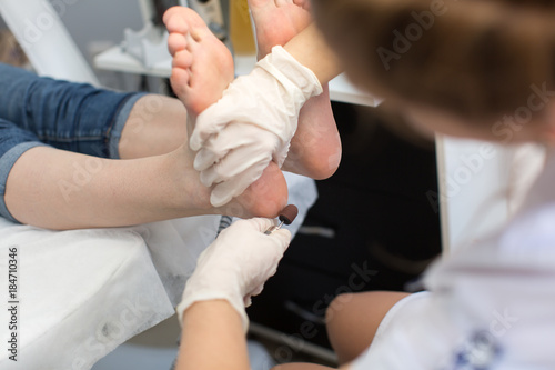 Process pedicure close-up, polishing feet