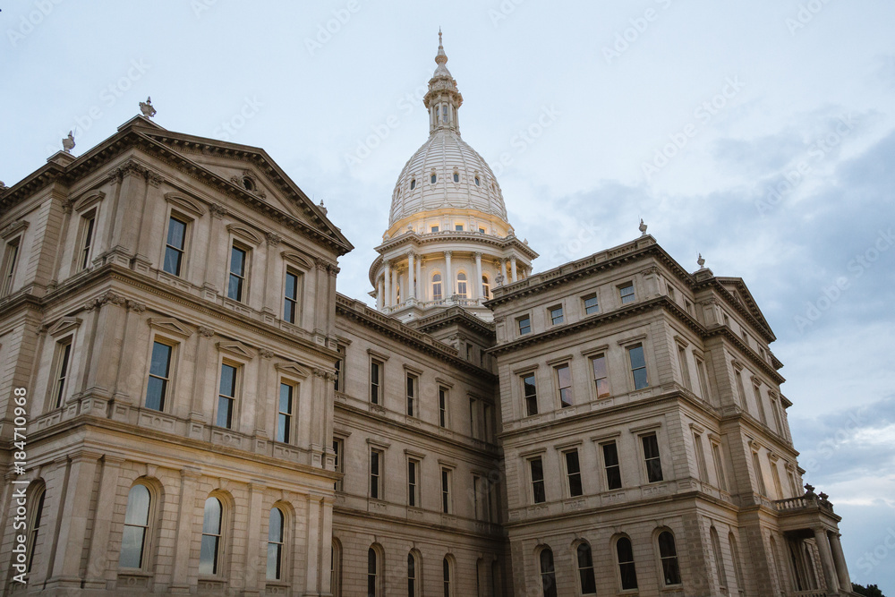 Lansing State Capitol Building in Michigan after a rainy day with the clouds still out. Another angle with more focus on the dome.
