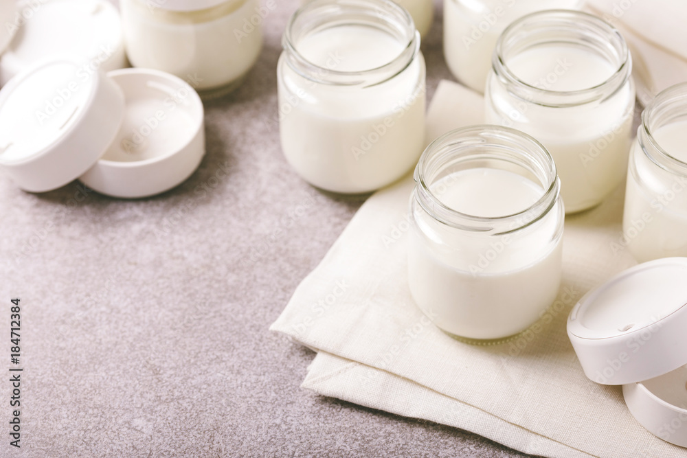 Homemade greek yogurt on gray stone background. Healthy food Homemade greek yogurt on gray stone background. Healthy food