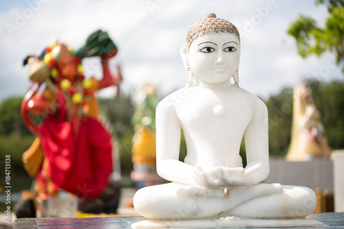 Indian statues on the background of the lake in Mauritius. Grand Bassin