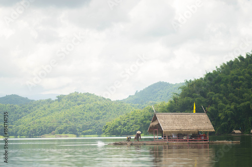 Rafting in nature with river , mountain and blue sky. photo