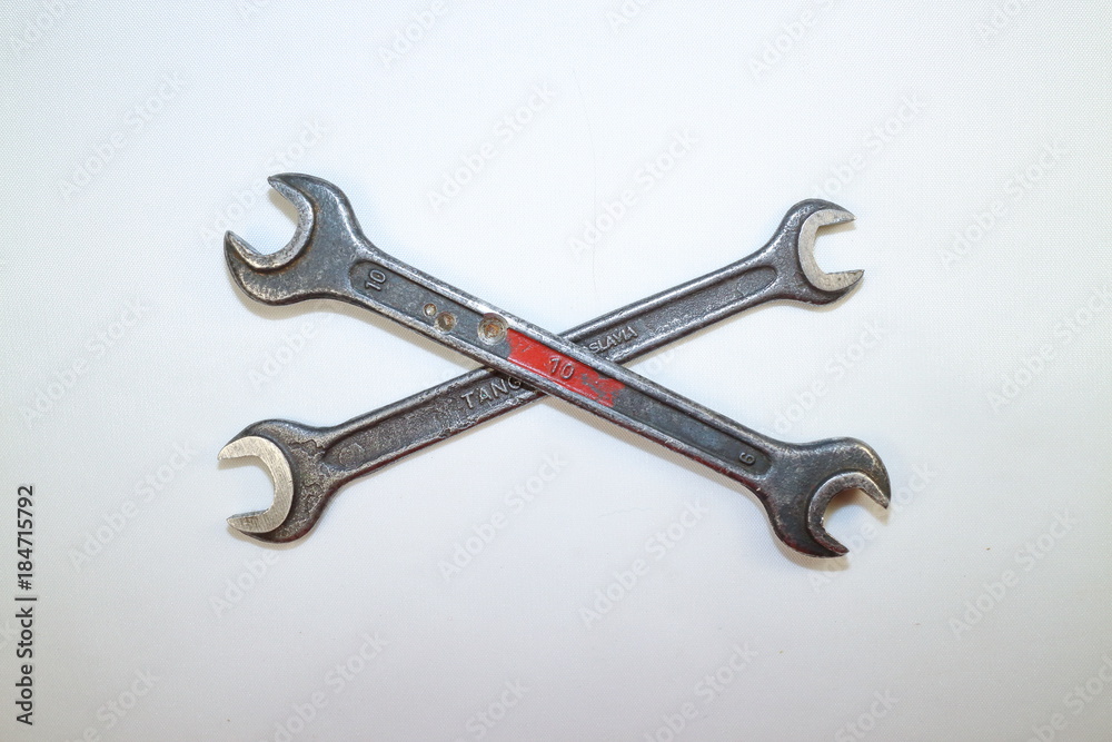 tools for work, two steel spanners in different positions on a white background tools for work, two steel spanners in different positions on a white background