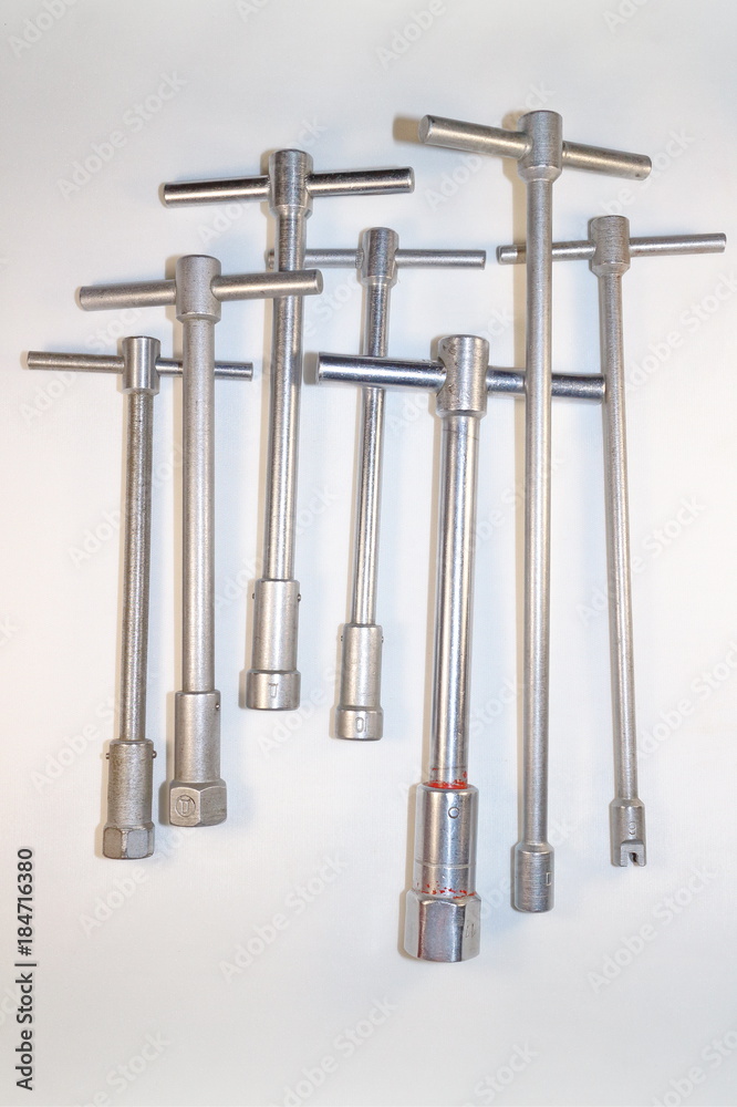 tools for work, end wrenches in different positions on a white background tools for work, end wrenches in different positions on a white background