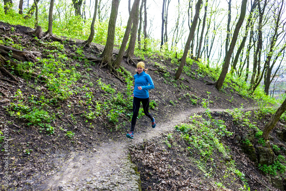 Obraz premium Girl running in the woods..